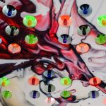 Abstract spray painted wine glass splash LED bottle display holder.