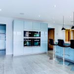 a modern and sleek kitchen in high gloss blue.