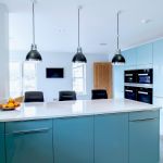 a modern and sleek kitchen in high gloss blue.