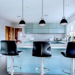 a modern and sleek kitchen in high gloss blue.