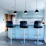 a modern and sleek kitchen in high gloss blue.
