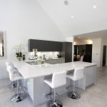 Large breakfast bar seating area on kitchen peninsula perfect for entertaining guest while cooking and prepping food.