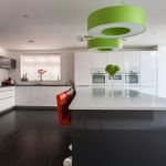 German engineered Hacker kitchen shown in pearl grey and polar white gloss with white cosmic and grey glitter quartz.