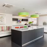Monotone modern kitchen accessories with pops of bright colour. With LED plinth lights and under cupboard wall lights.