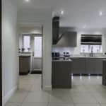 High end modern matt cashmere kitchen with matching utlity room units.